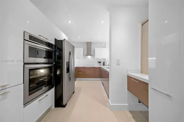 a view of a kitchen from the hallway