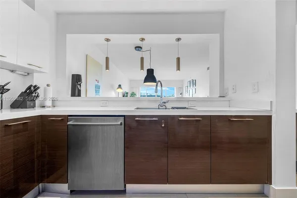a bathroom with a sink vanity and mirror
