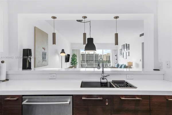 a kitchen with a sink and a window