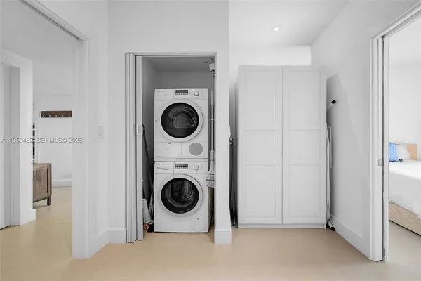 a view of a hallway with washer and dryer