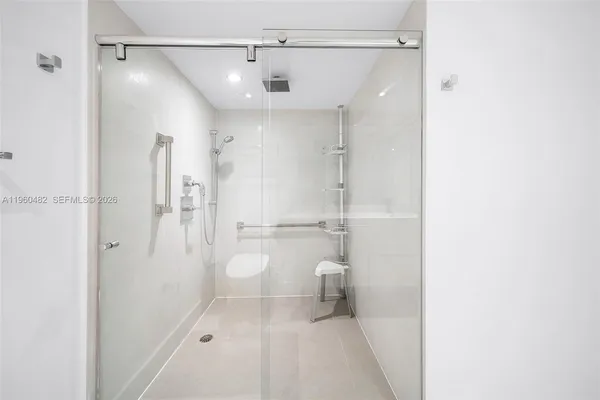 a bathroom with a shower and a toilet