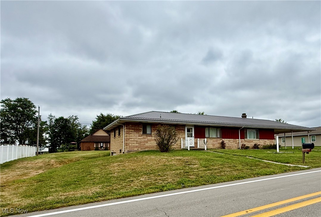 923 Archer Hill Road Colliers, WV 26035 - Photo 30 of 33 Ranch-style home with stone siding and a metal roof