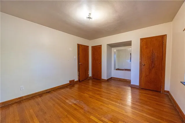 a living room with furniture and view of kitchen