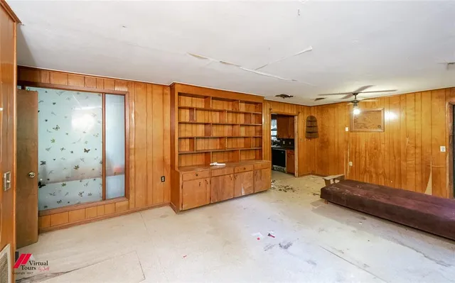 a kitchen with a sink appliances and cabinets