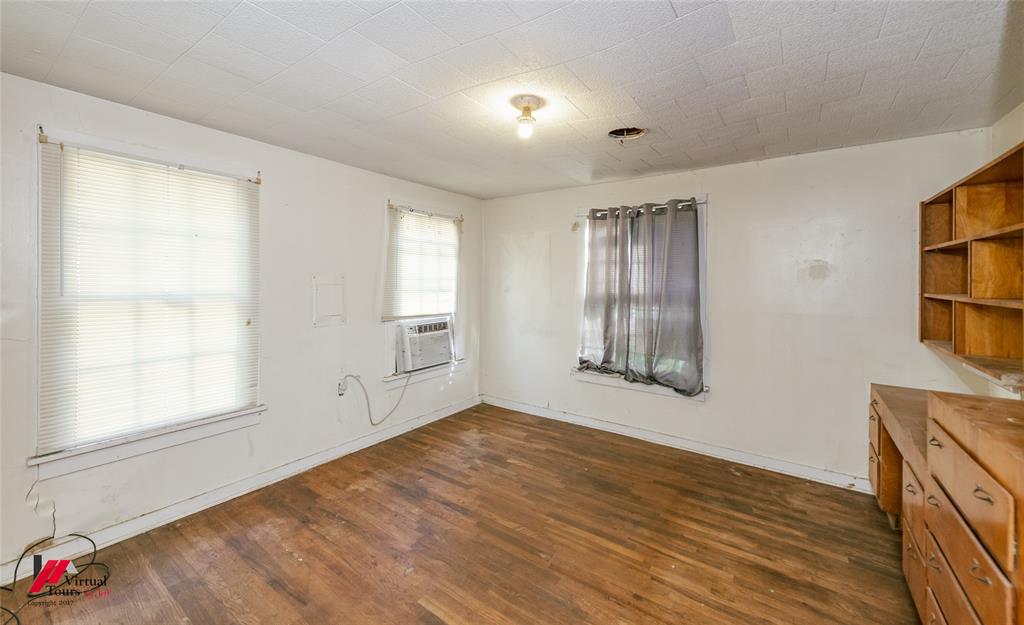 206 North Street Springhill, LA 71075 - Photo 27 of 28 wooden floor in an empty room with a window