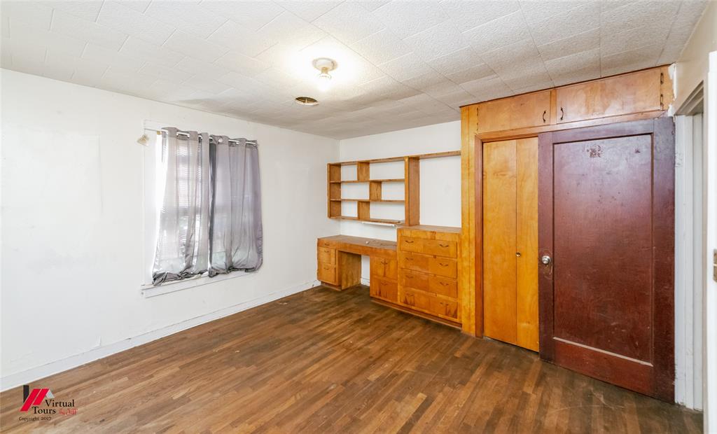 206 North Street Springhill, LA 71075 - Photo 28 of 28 an empty room with wooden floor and windows