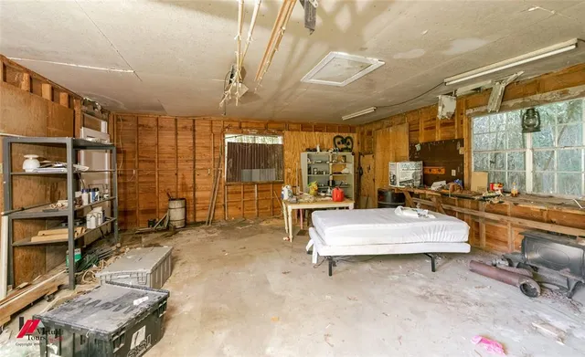 a room with pool table and glass windows
