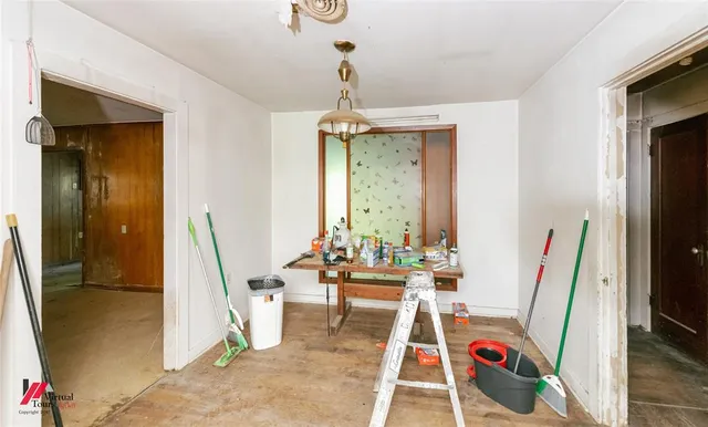 a room with furniture a rug and a window