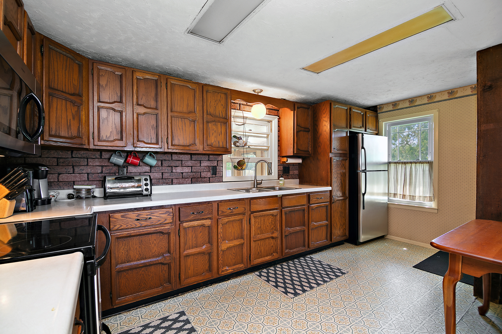 2244 West 2000S Road Kankakee, IL 60901 - Photo 8 of 29 a kitchen with sink cabinets and window