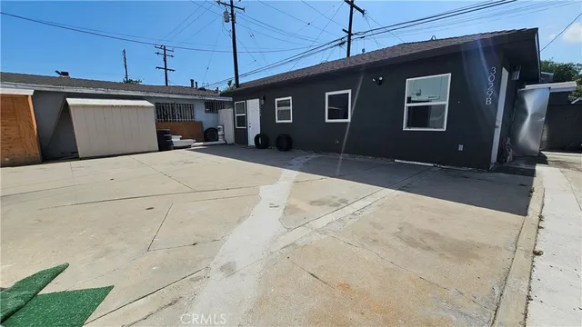 a kitchen with a refrigerator and a stove