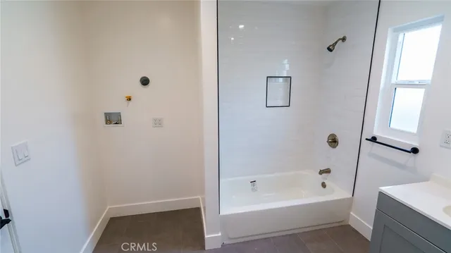 a bathroom with a toilet a sink and a mirror