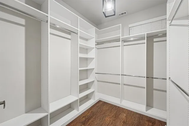 a view of an empty walk in closet