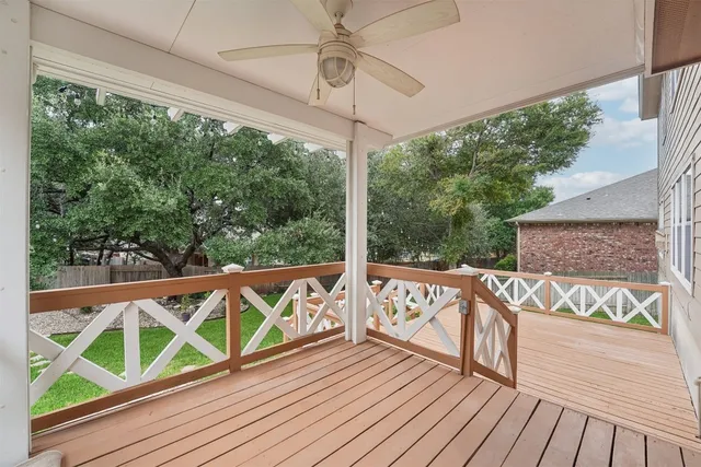 a view of a balcony with wooden floor