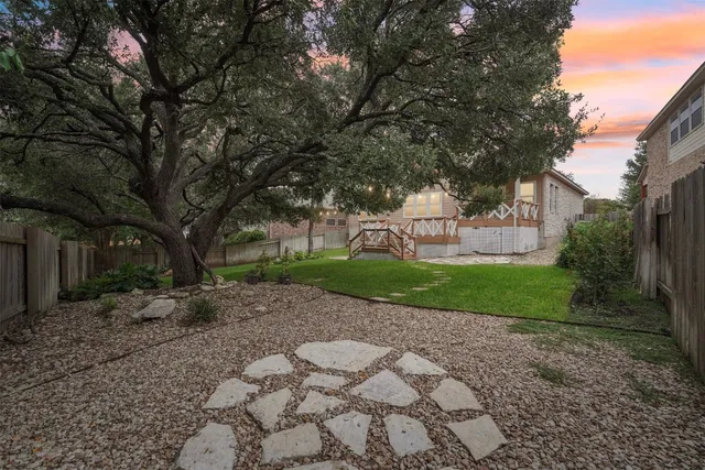a view of a park with large trees