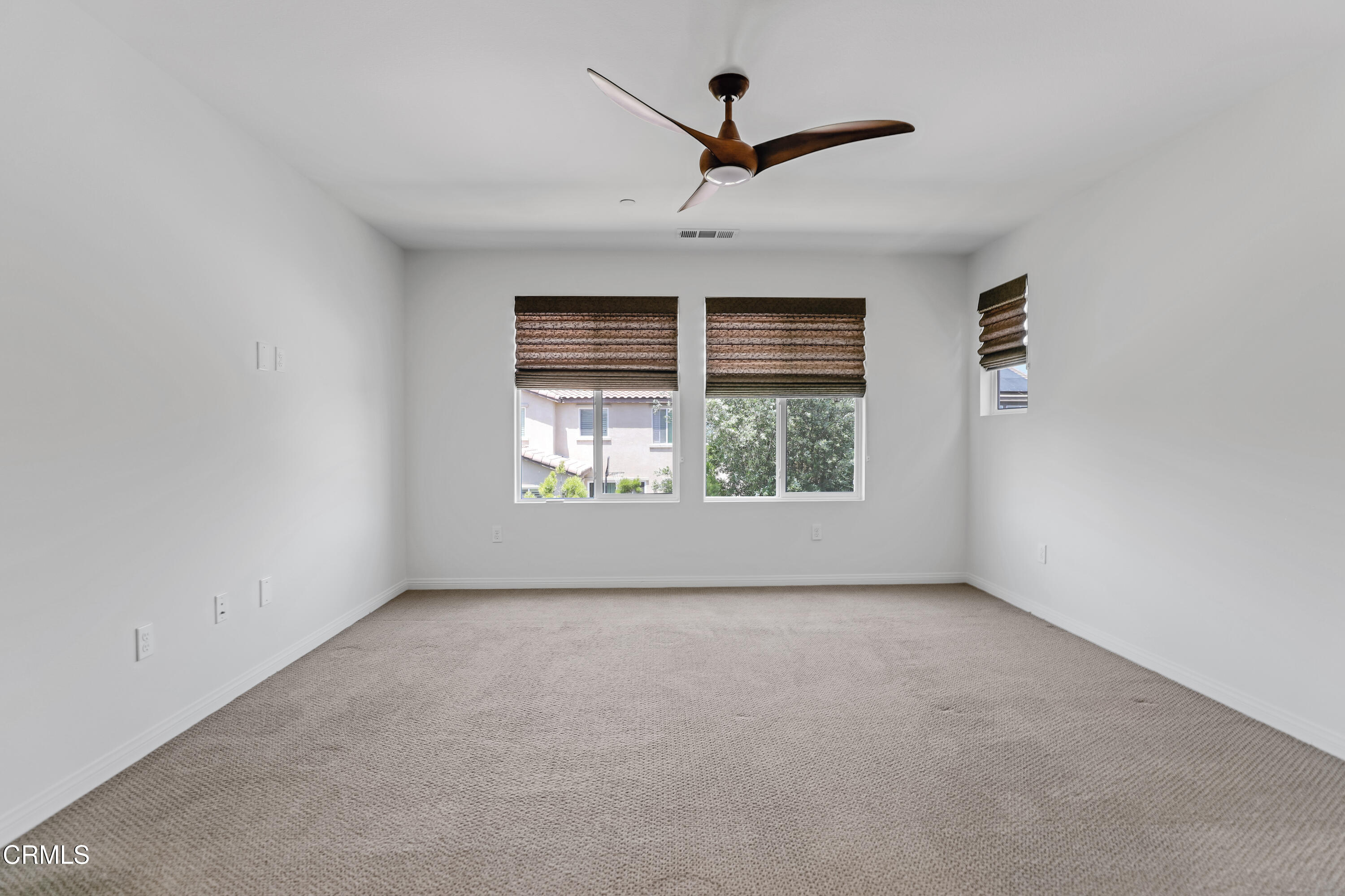 665 Tiber River Way Oxnard, CA 93036 - Photo 20 of 27 an empty room with windows and ceiling fan