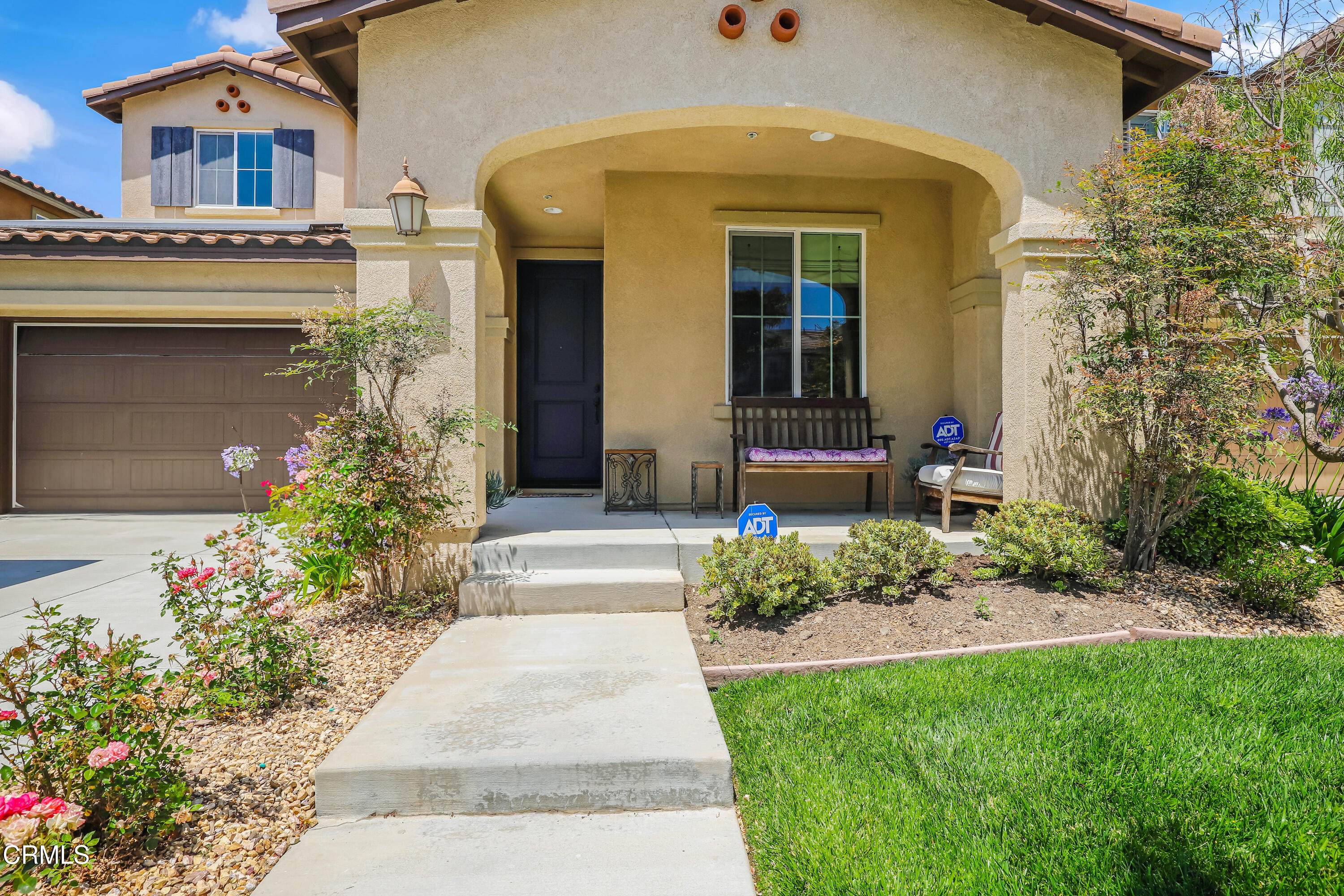 665 Tiber River Way Oxnard, CA 93036 - Photo 2 of 27 a front view of a house with a porch