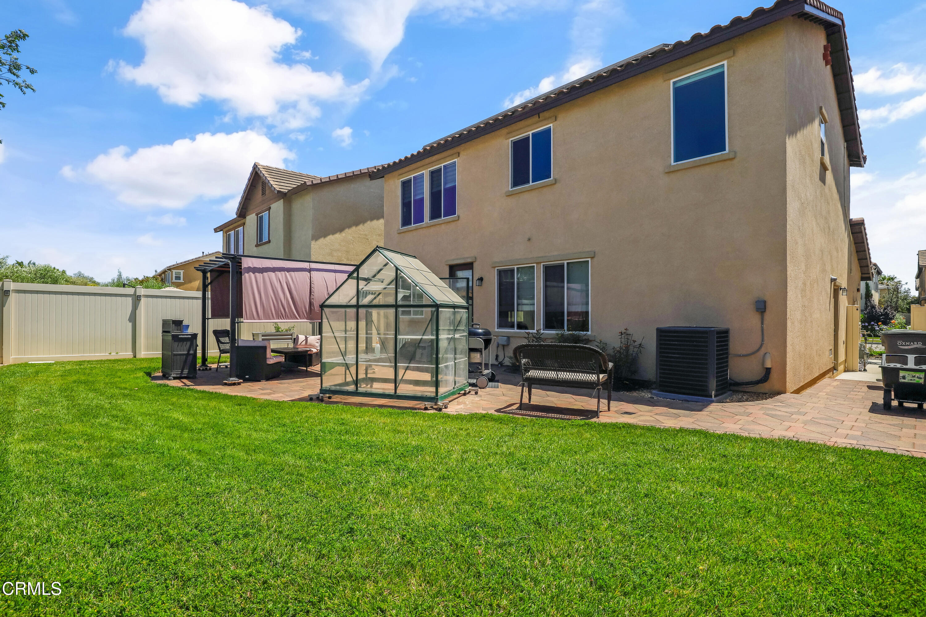 665 Tiber River Way Oxnard, CA 93036 - Photo 26 of 27 a view of a house with a yard and sitting area