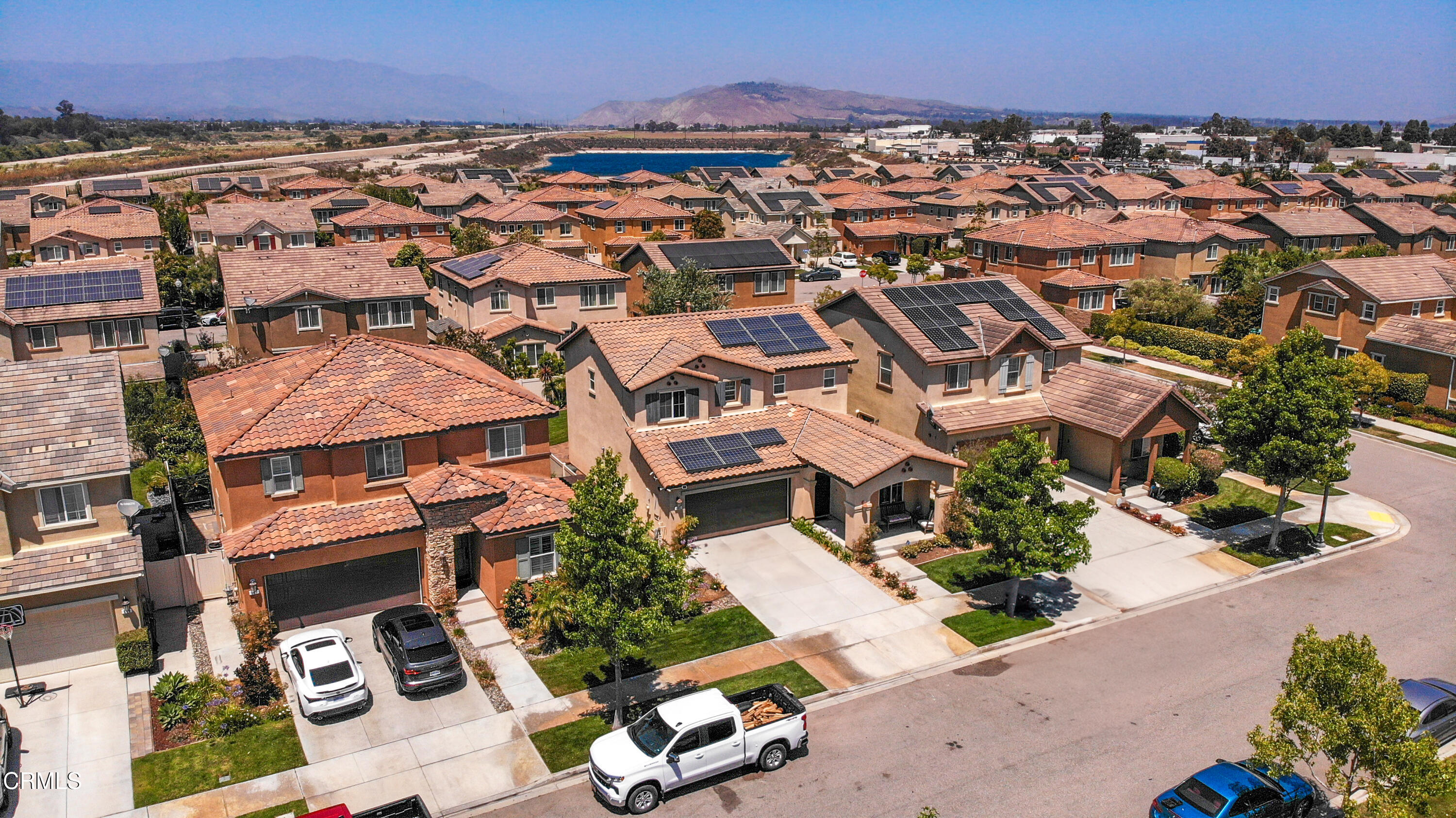 665 Tiber River Way Oxnard, CA 93036 - Photo 4 of 27 an aerial view of multiple houses with yard