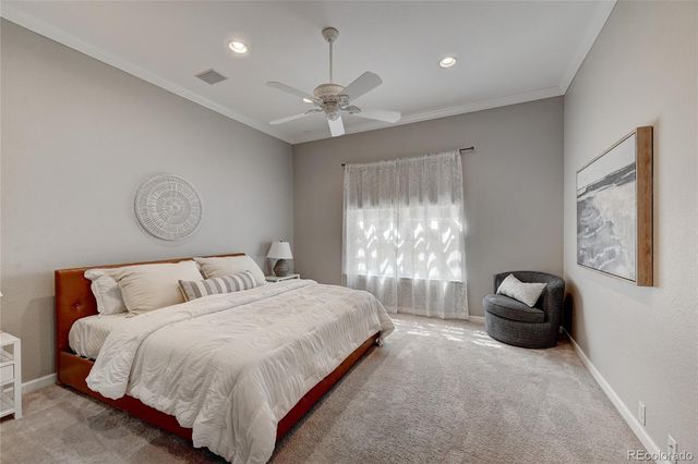 a bedroom with bed and window