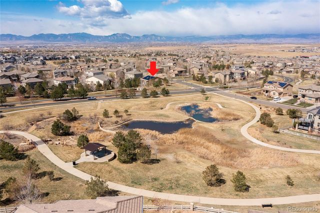 a view of a house with a snow in the yard