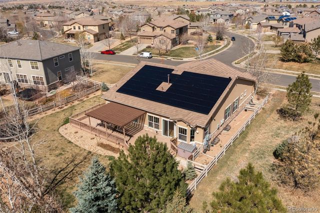 a view of house with a roof deck