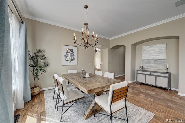a view of a dining room with furniture and window