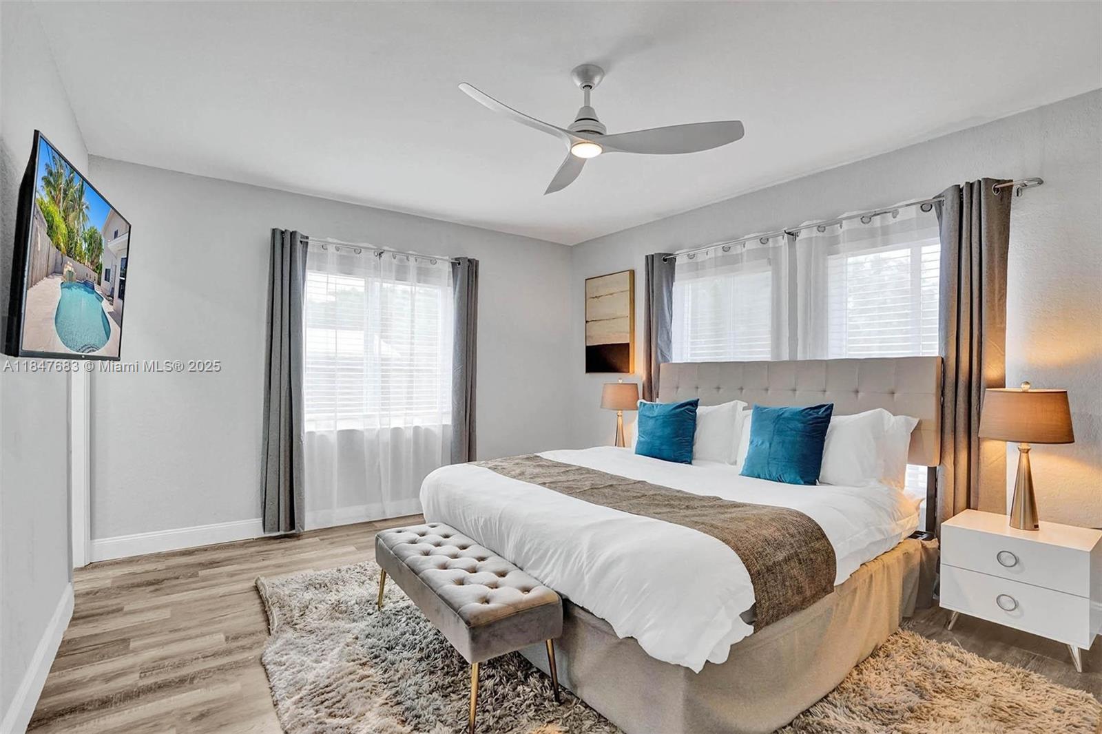 3421 Dover Road Pompano Beach, FL 33062 - Photo 43 of 83 a bedroom with a bed and wooden floor