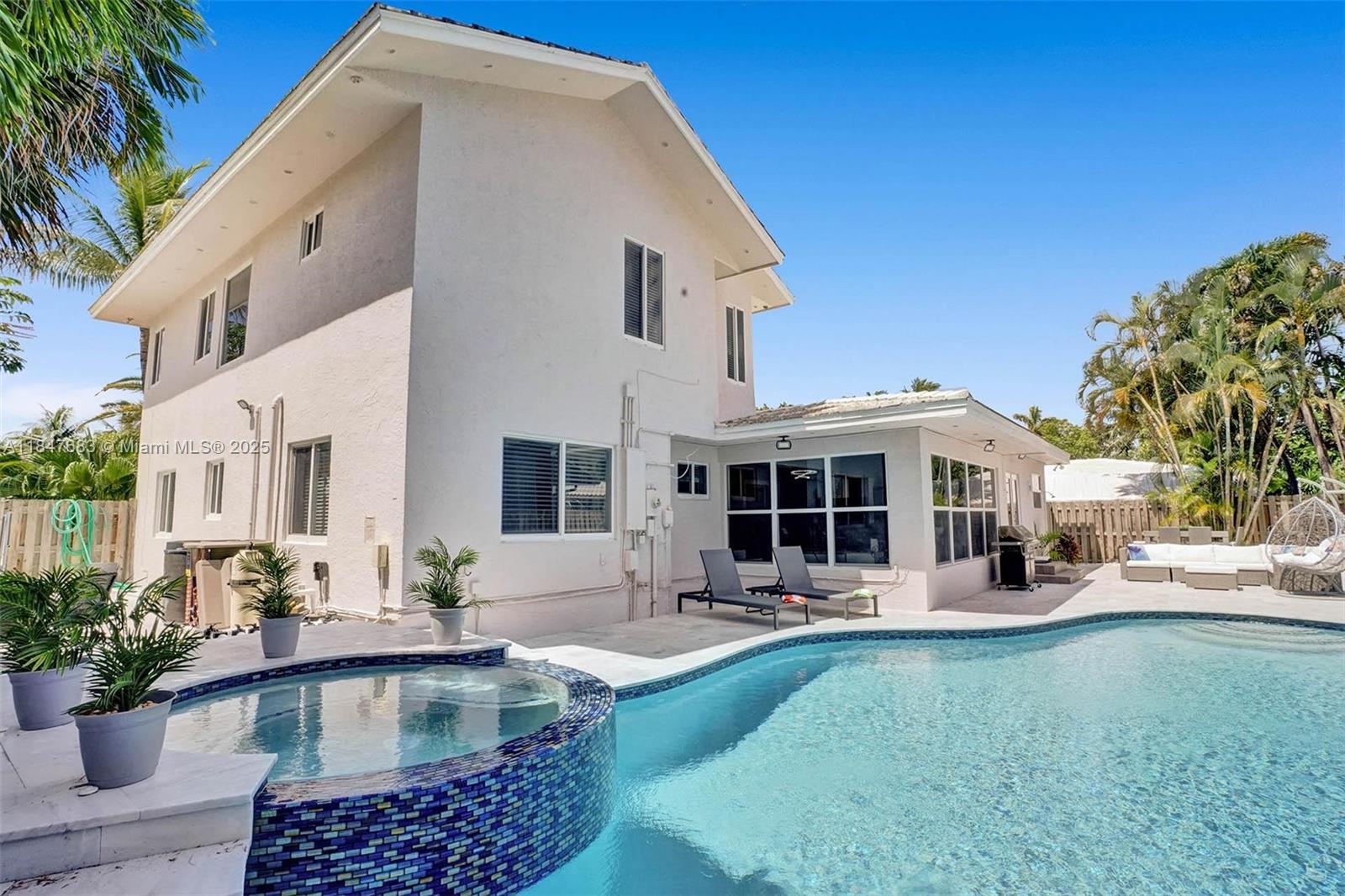 3421 Dover Road Pompano Beach, FL 33062 - Photo 59 of 83 a view of a house with backyard swimming pool and sitting area