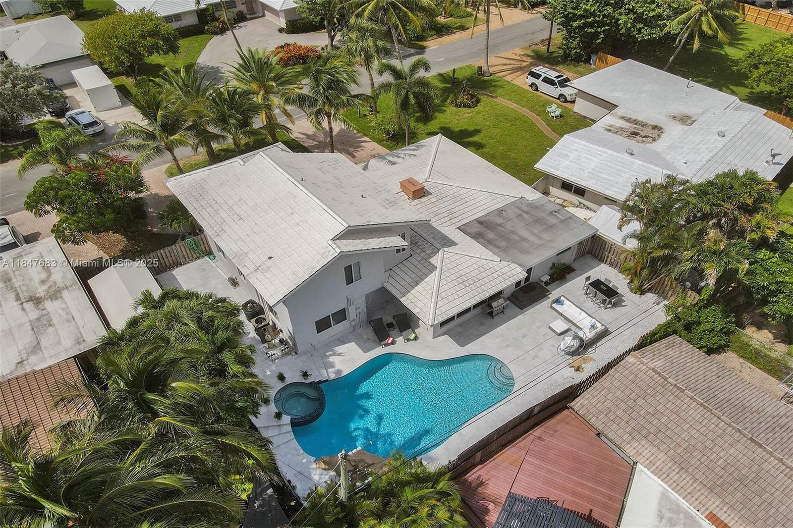 3421 Dover Road Pompano Beach, FL 33062 - Photo 7 of 83 an aerial view of a house with a yard