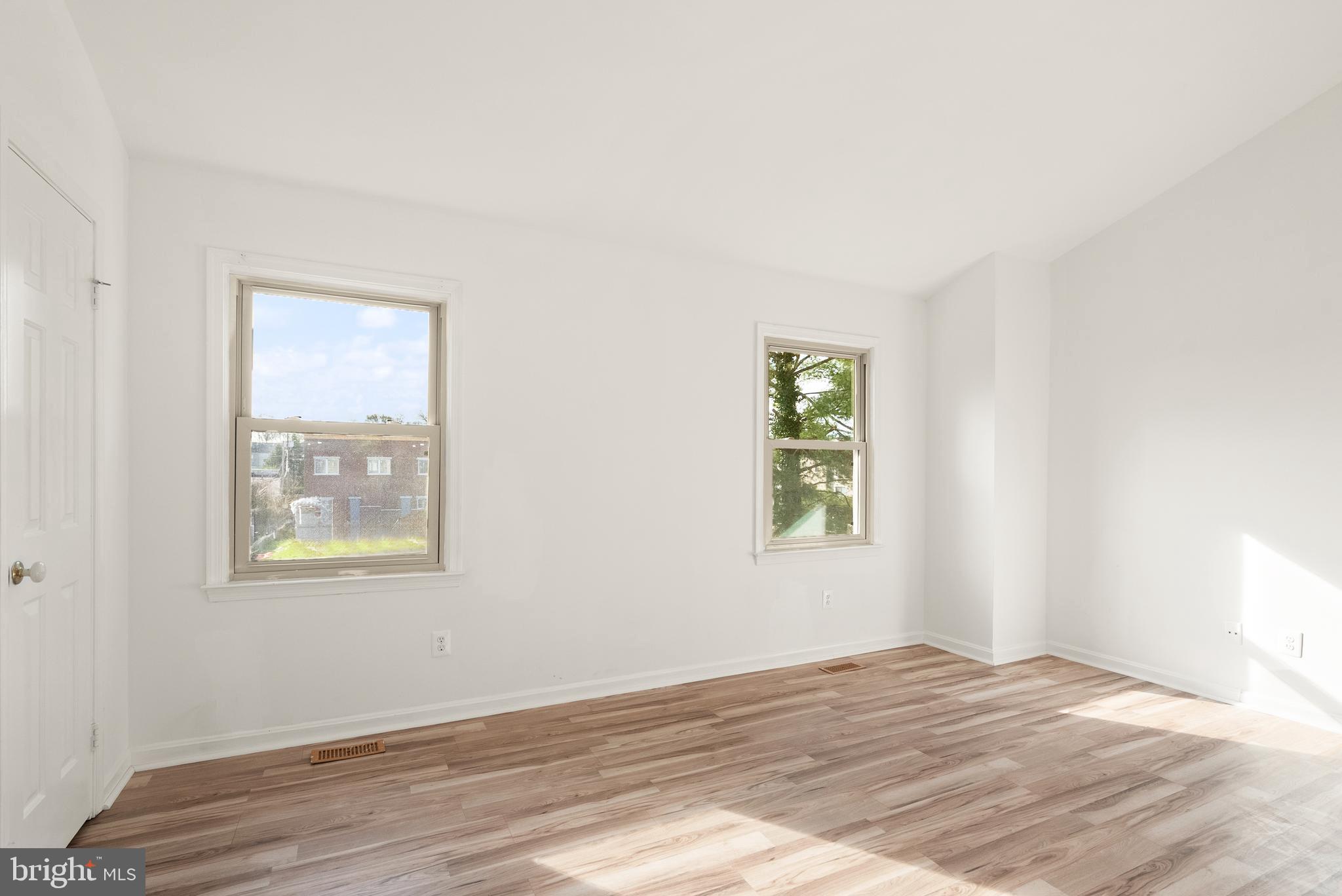 3733 Roxbury Lane Alexandria, VA 22309 - Photo 17 of 37 a view of an empty room with wooden floor and a window