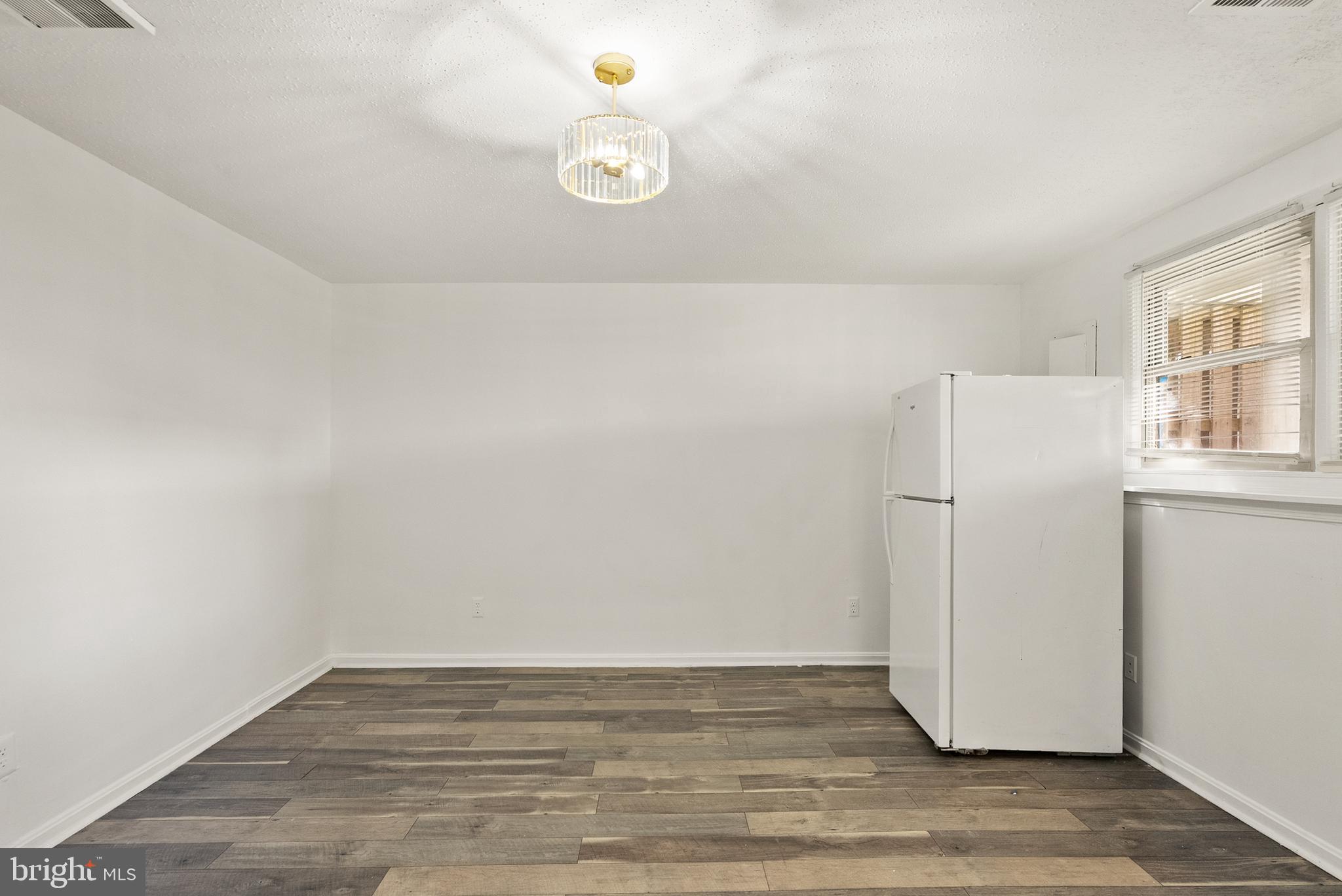 3733 Roxbury Lane Alexandria, VA 22309 - Photo 25 of 37 a view of a room with wooden floor and white walls