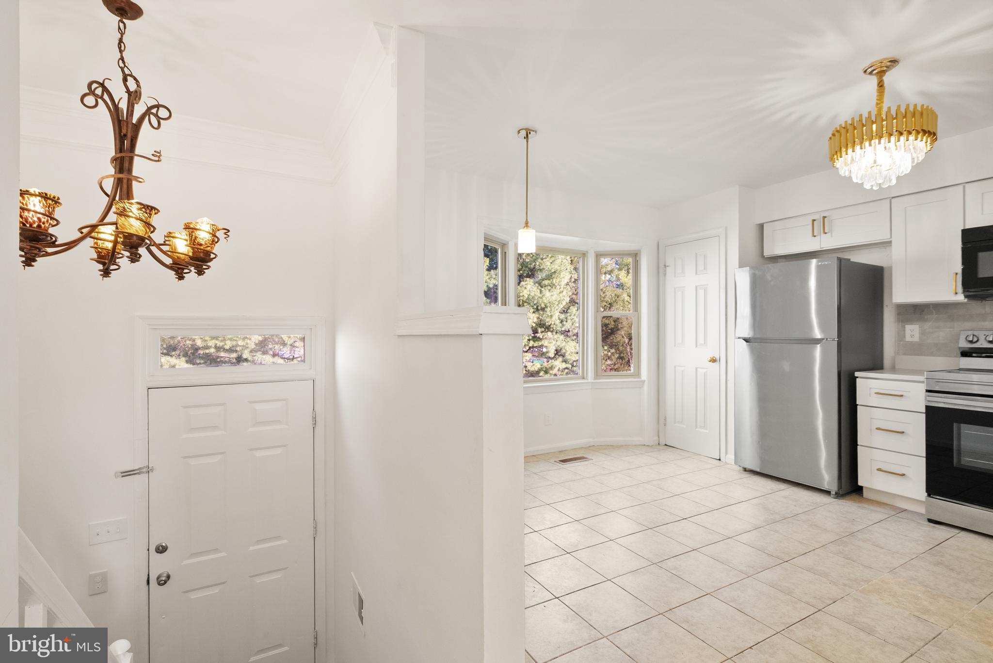 3733 Roxbury Lane Alexandria, VA 22309 - Photo 3 of 37 a bathroom with a refrigerator and a sink