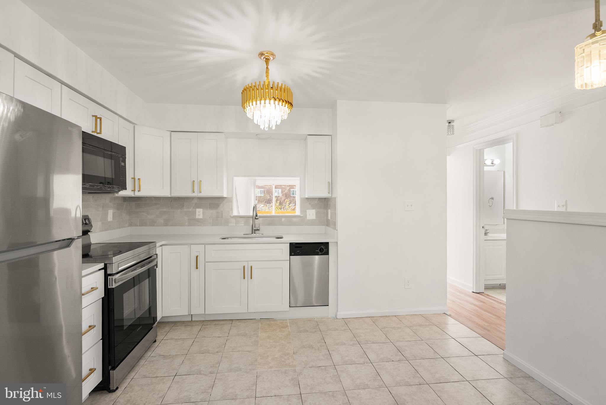 3733 Roxbury Lane Alexandria, VA 22309 - Photo 5 of 37 a kitchen with cabinets and stainless steel appliances