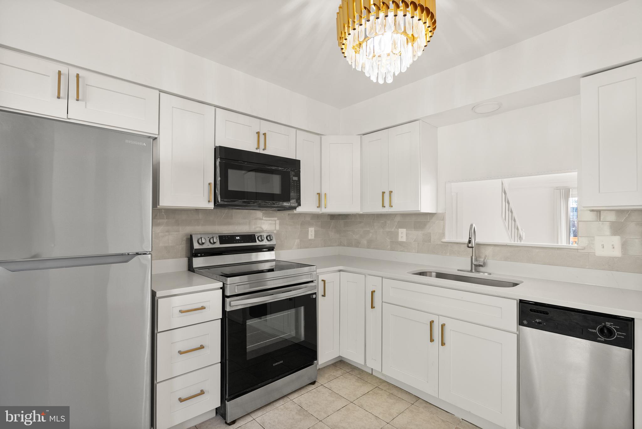 3733 Roxbury Lane Alexandria, VA 22309 - Photo 6 of 37 a kitchen with cabinets stainless steel appliances a sink and a window