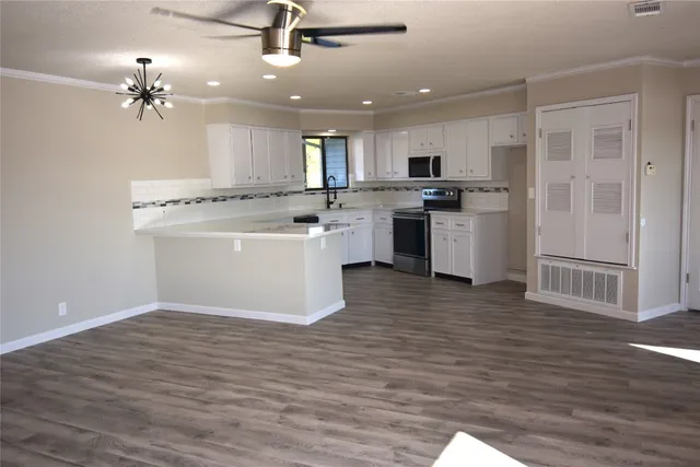 a kitchen with a sink and refrigerator