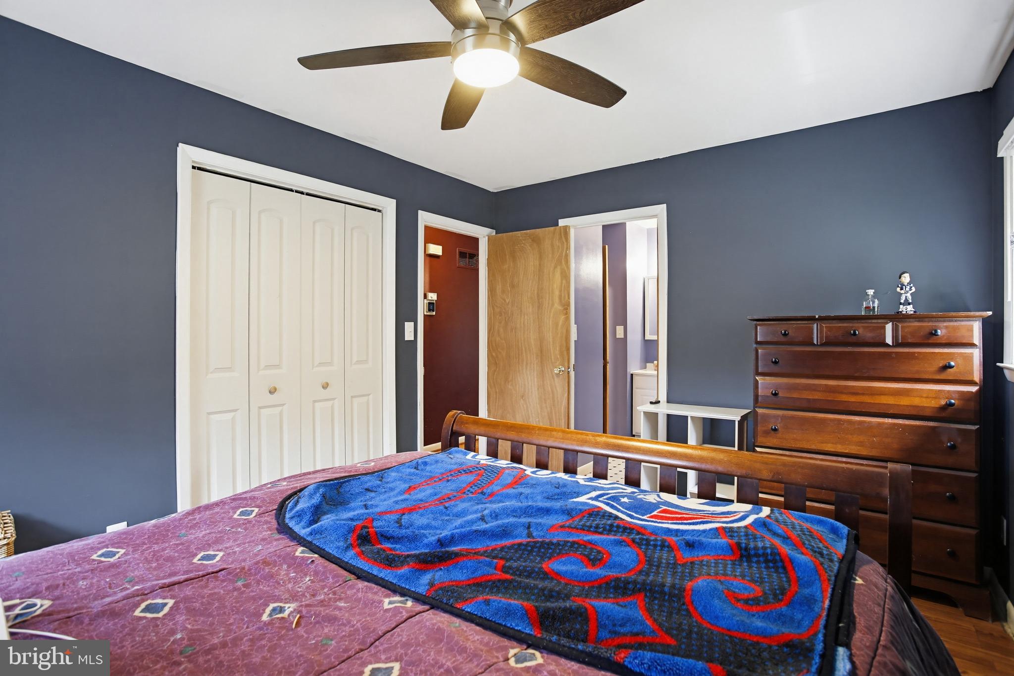 3703 Altondale Road Reisterstown, MD 21136 - Photo 15 of 34 a bedroom with a bed and a chandelier