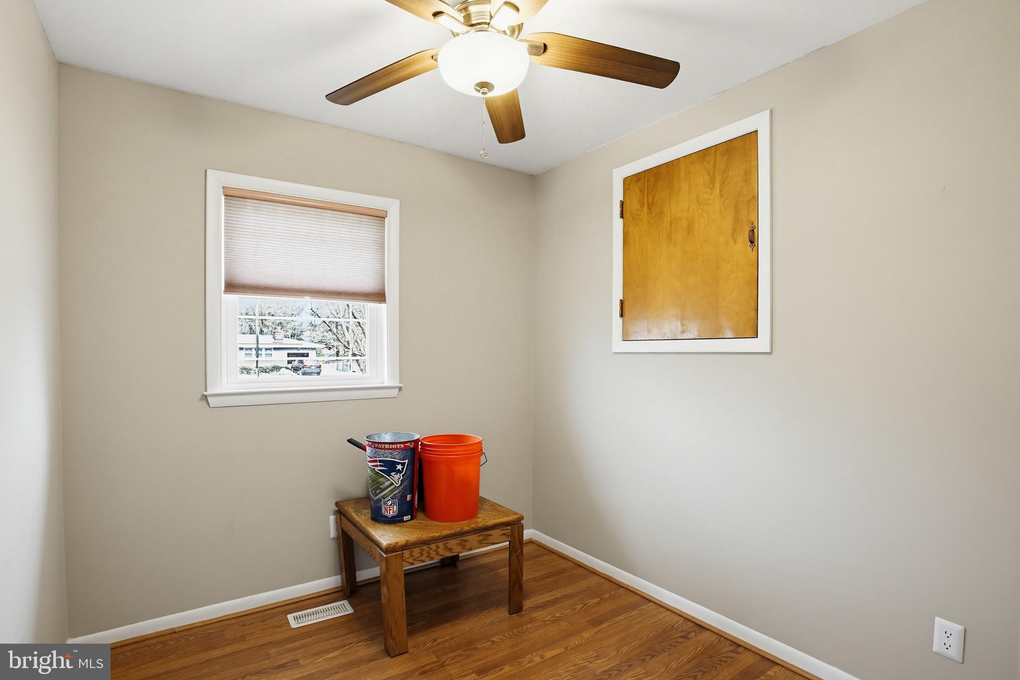 3703 Altondale Road Reisterstown, MD 21136 - Photo 20 of 34 a view of a workspace with wooden floor and a window