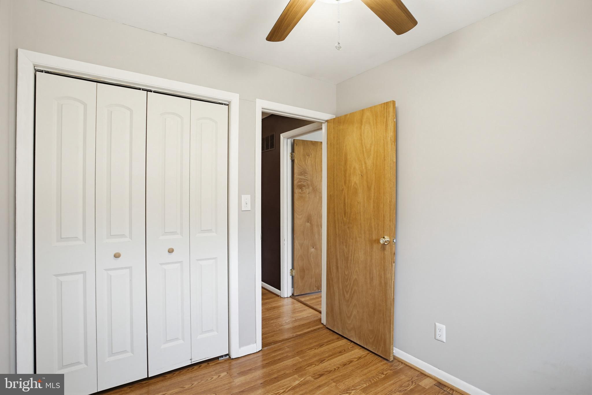 3703 Altondale Road Reisterstown, MD 21136 - Photo 21 of 34 an empty room with wooden floor and closet