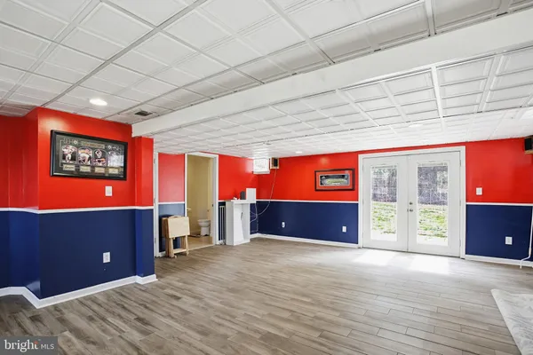 an empty room with furniture and natural light