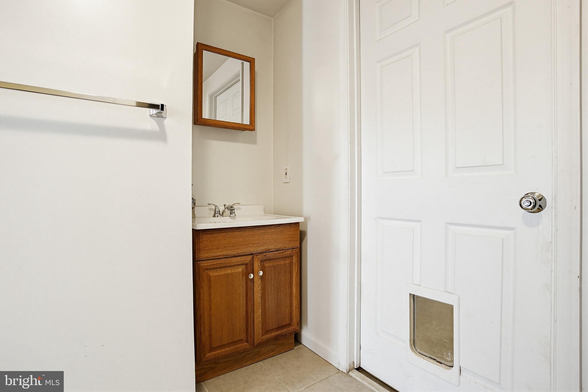 3703 Altondale Road Reisterstown, MD 21136 - Photo 27 of 34 a bathroom with a sink and a mirror