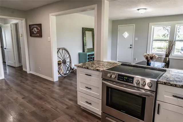 a kitchen with a stove and a refrigerator