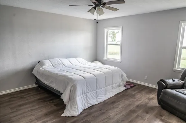 a bedroom with a bed and window