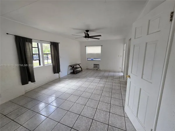 a view of an empty room and window