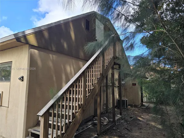 a view of backyard with green space