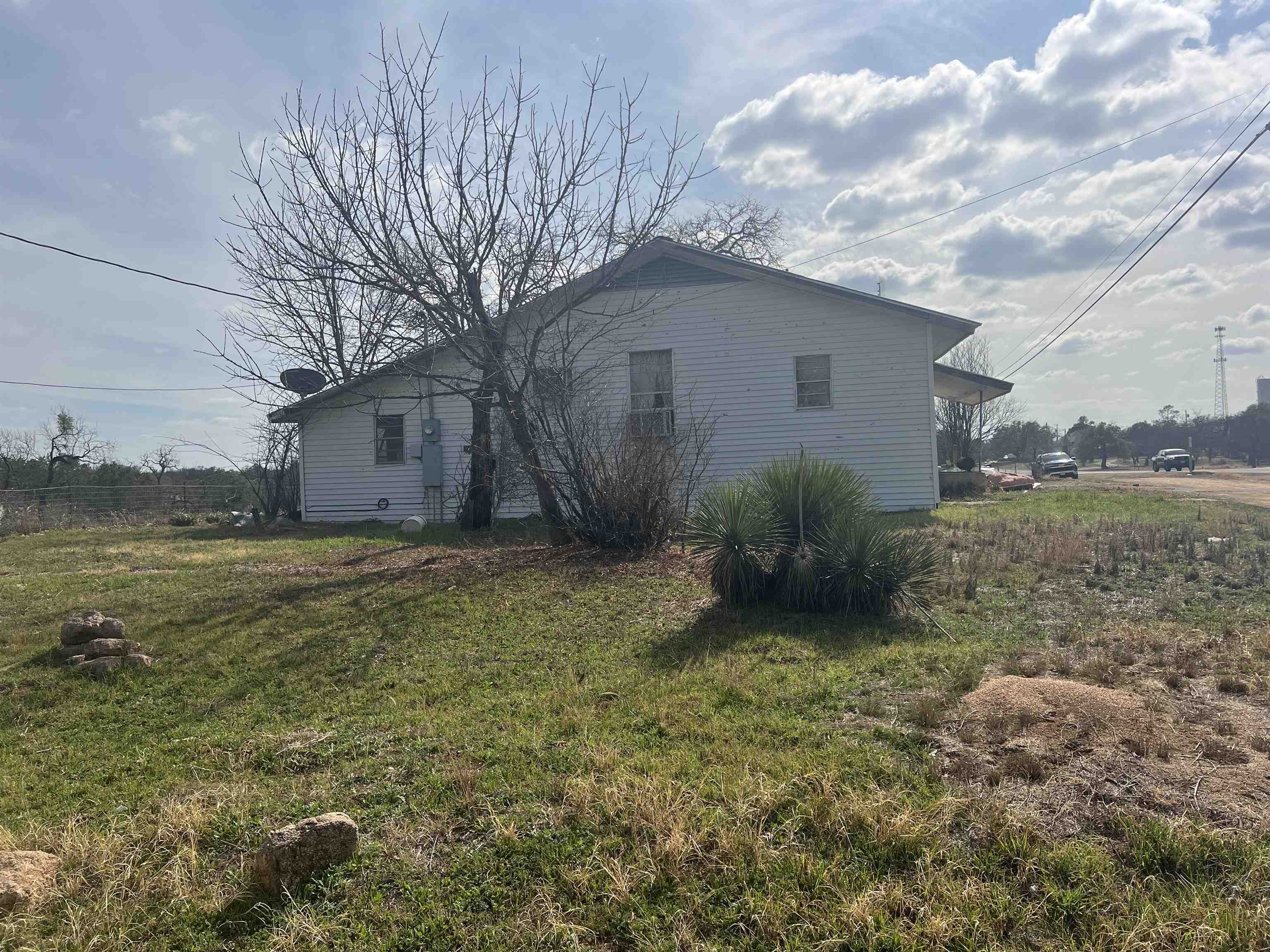 1034 Ranch Road 2545 Kingsland, TX 78639 - Photo 3 of 30 a view of a house with backyard and garden