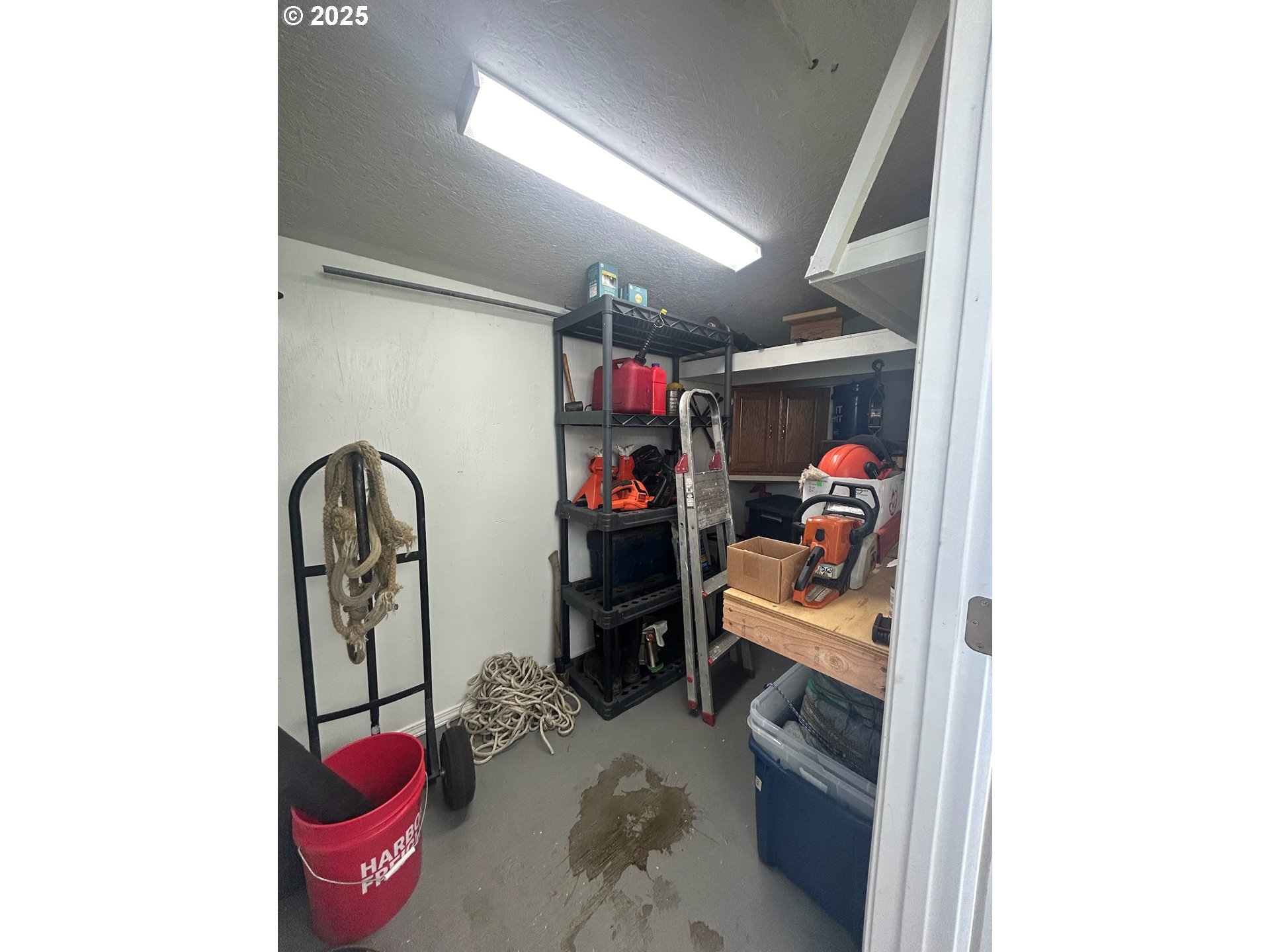 503 Southeast Sheridan Road, Unit 8 Sheridan, OR 97378 - Photo 13 of 38 a view of walk in closet with clothes and shoes
