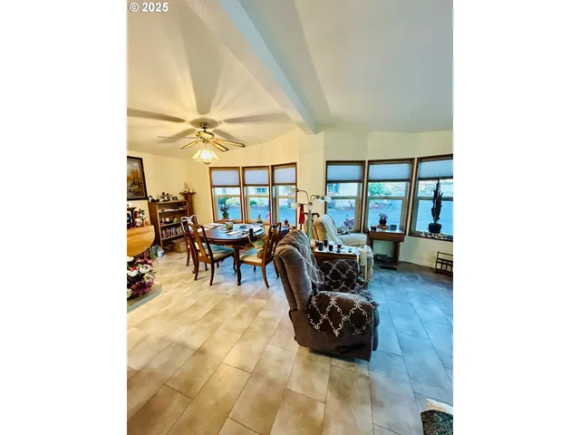 a view of walk in closet with clothes