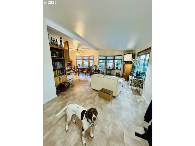 a bed room with a bed and a flat screen tv