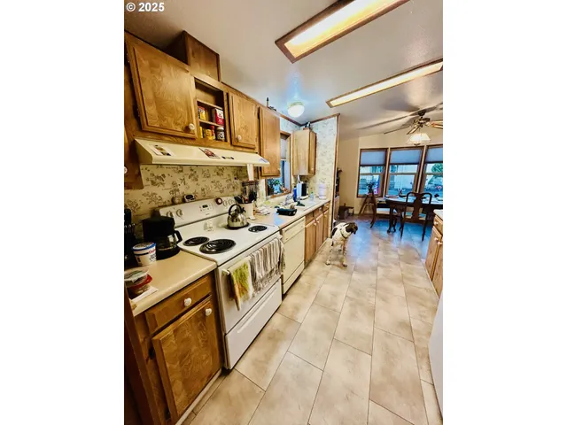 a kitchen with a refrigerator and cabinets
