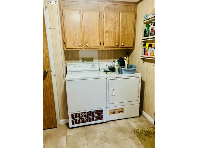 a bed sitting in a bedroom next to a bathroom